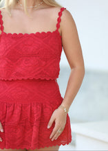 Load image into Gallery viewer, Red lace dress worn by a person with a blurred background
