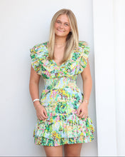 Load image into Gallery viewer, Woman wearing a colorful floral dress on a white background