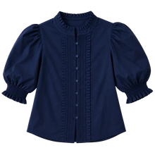 Load image into Gallery viewer, A navy blue blouse with a high ruffled collar, puffed elbow-length sleeves, and a vertical ruffle detail down the front with matching buttons, laid flat on a light beige background.