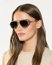 Load image into Gallery viewer, Woman wearing sunglasses with a neutral background