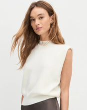 Load image into Gallery viewer, Woman wearing a white sleeveless top and gray skirt on a light background