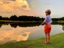 Load image into Gallery viewer, Boy fishing wearing the Bowen Arrow Button Down in Pawleys Island Plaid